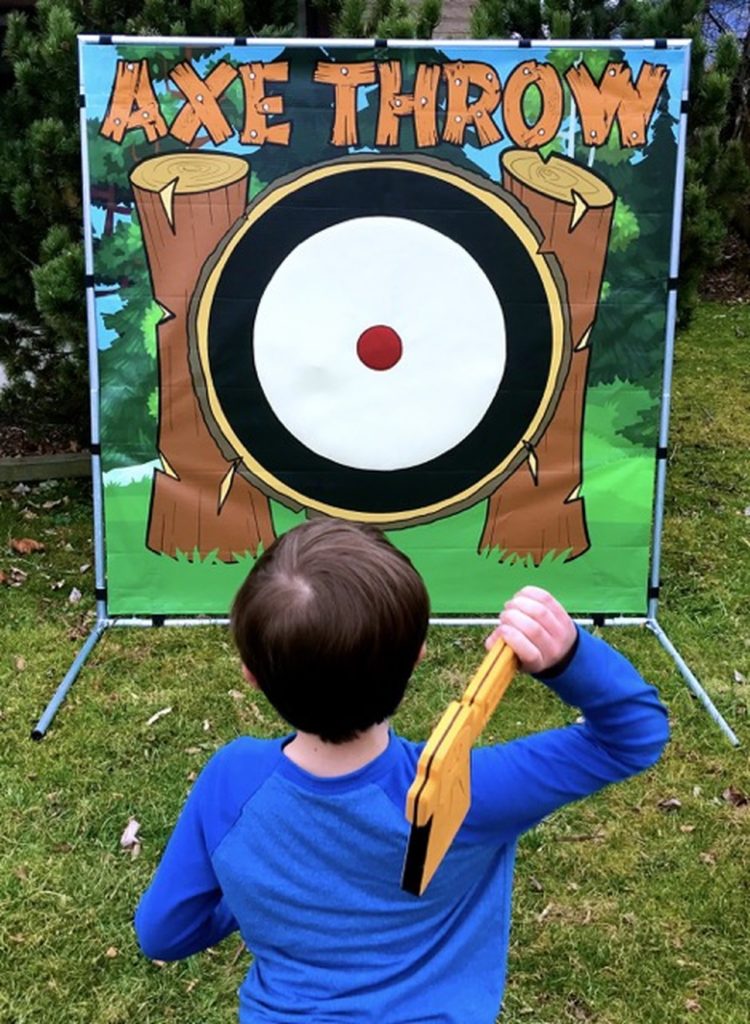 Boy throwing foam axe at the target!